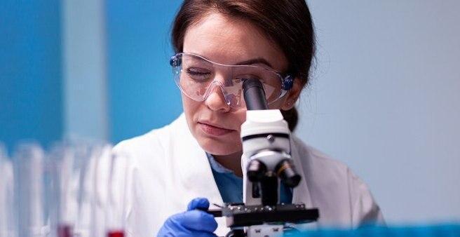 woman scientist white coat looking high end microscope pharmacy expertise 482257 7978 2 2