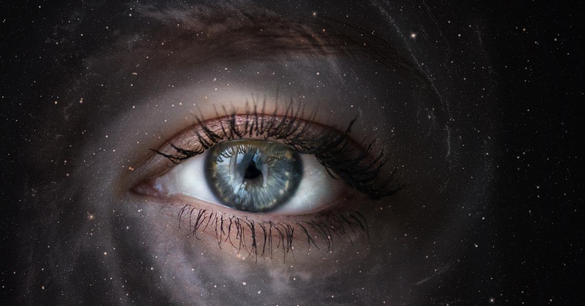 Space galaxy with human eye Concept image