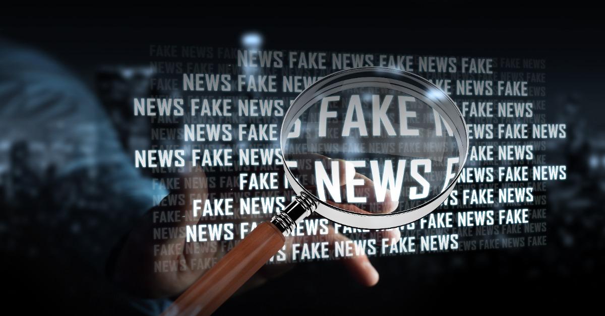 Businessman on blurred background discovering fake news information