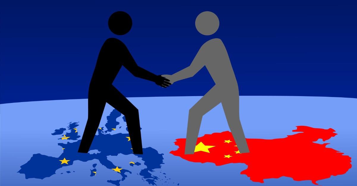 European and Chinese business men meeting with handshake