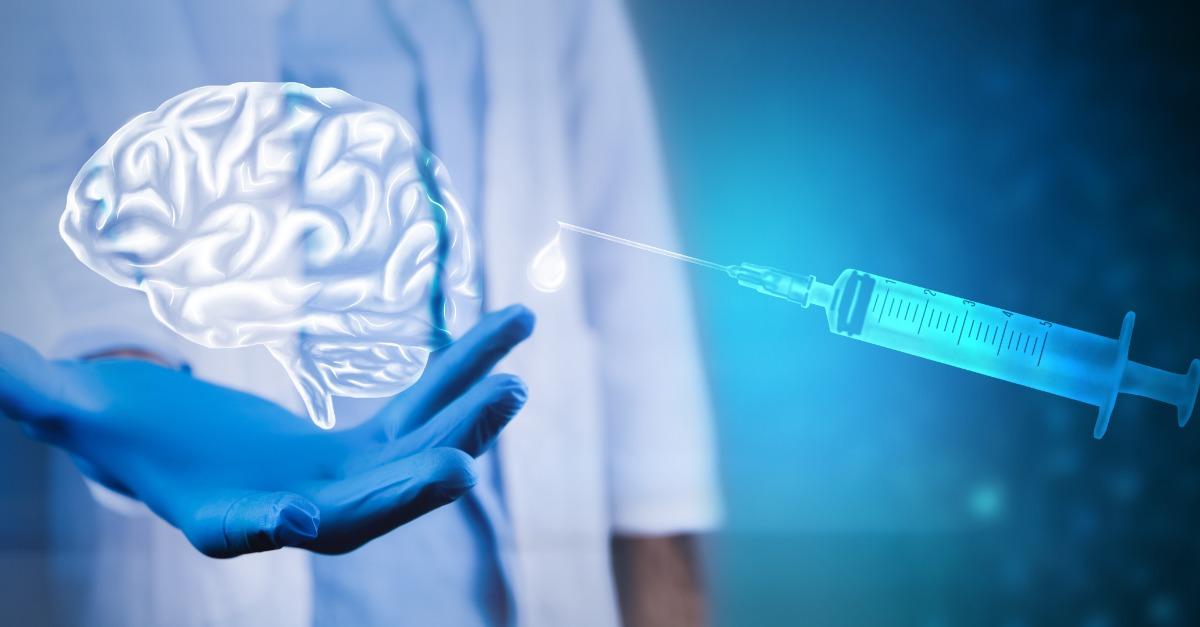 Human brain with syringe