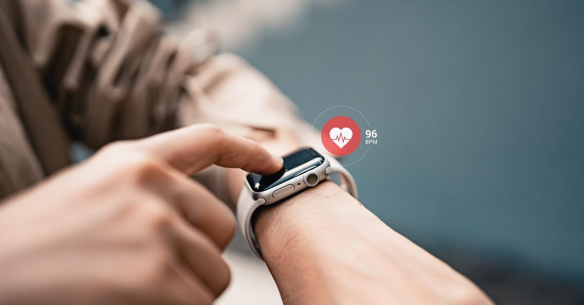 Woman using smart watches with checking pulse via health application. healthcare and people concept